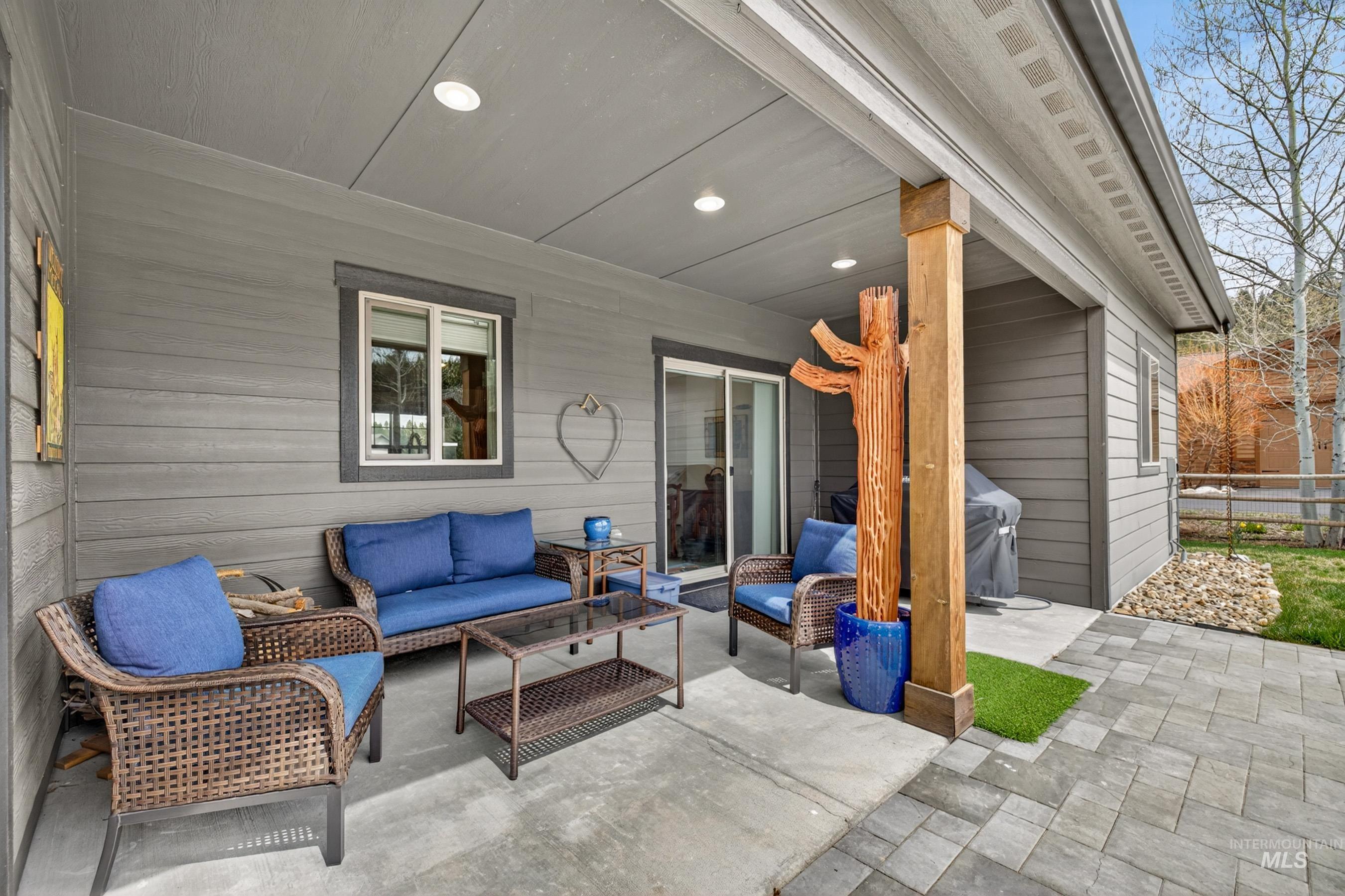 1126 Mo's Way McCall, ID 83638 - Photo 37 of 50 Covered patio with recessed lighting, concrete flooring, and a structural wood beam
