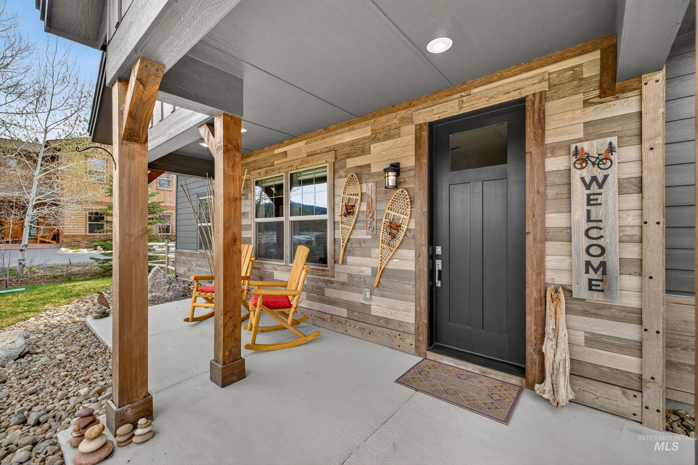 1126 Mo's Way McCall, ID 83638 - Photo 4 of 50 Covered front porch featuring exposed wood support beams