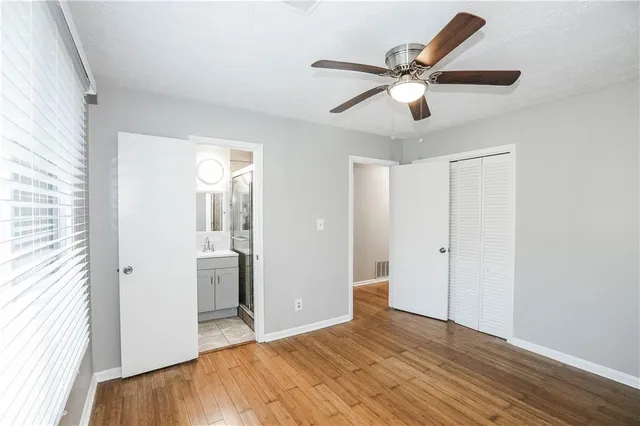 a bathroom with a sink a mirror and a shower