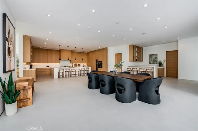 a large kitchen with stainless steel appliances lots of counter top space