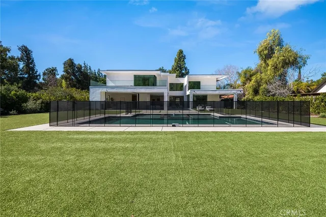 a view of a house with a swimming pool