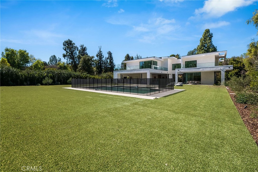 4930 Palomar Drive Tarzana, CA 91356 - Photo 23 of 43 a view of a house with a big yard and large trees