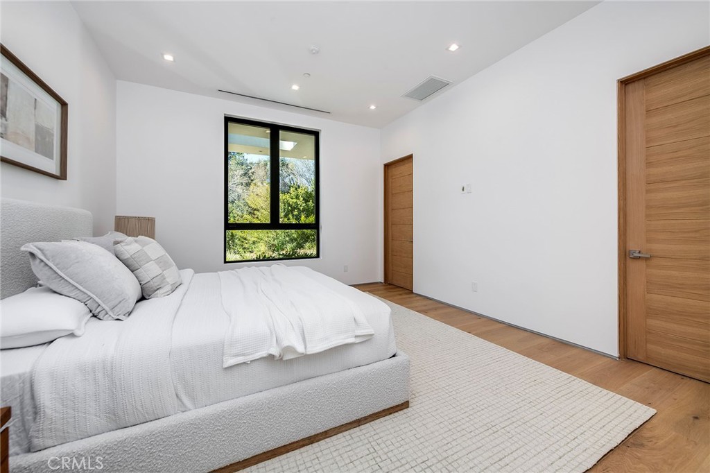 4930 Palomar Drive Tarzana, CA 91356 - Photo 26 of 43 a bed room with a bed and a window