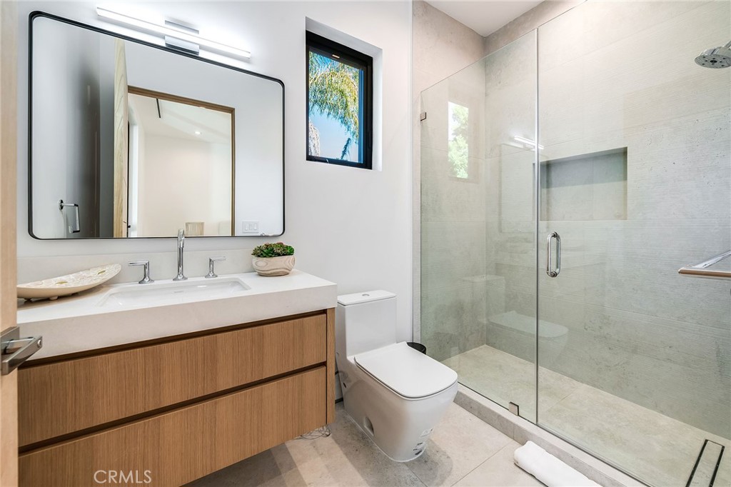 4930 Palomar Drive Tarzana, CA 91356 - Photo 27 of 43 a bathroom with a sink a toilet and shower