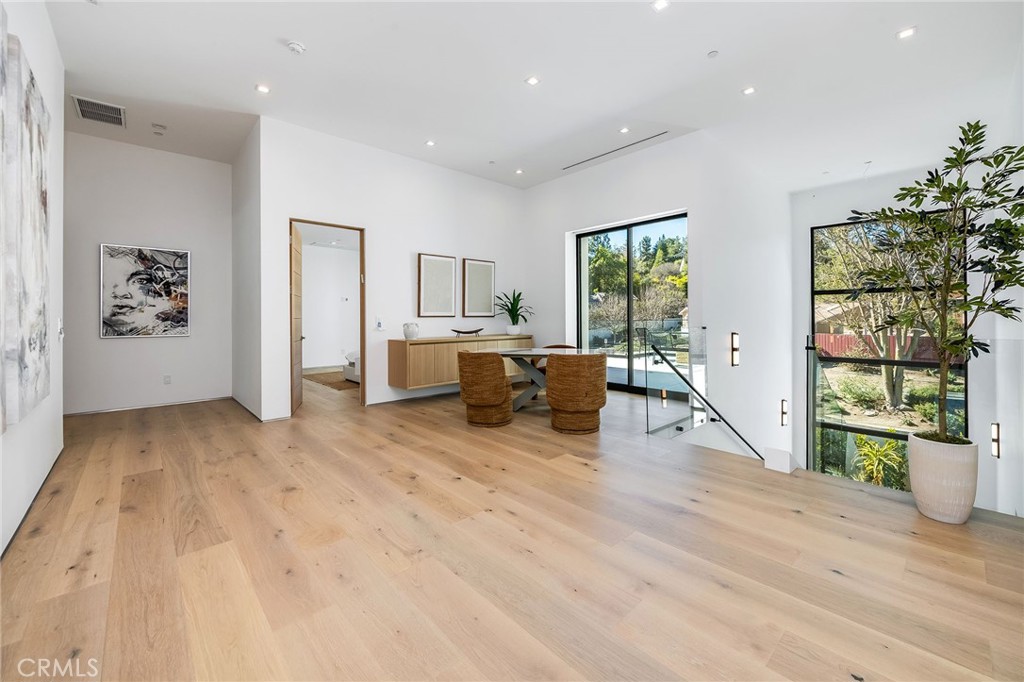 4930 Palomar Drive Tarzana, CA 91356 - Photo 28 of 43 a living room with furniture and wooden floor