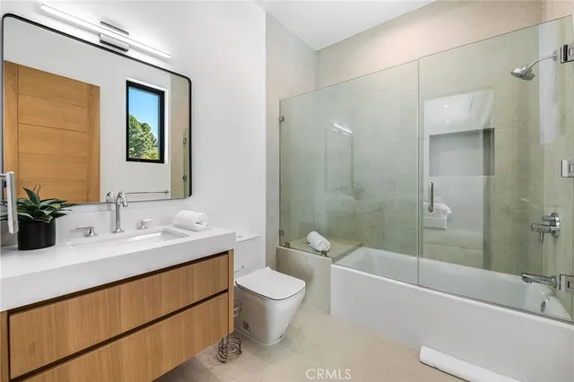 a bedroom with bed and a window