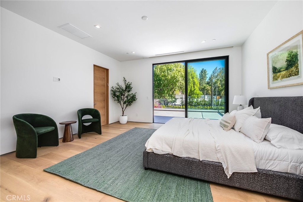 4930 Palomar Drive Tarzana, CA 91356 - Photo 33 of 43 a bedroom with a bed and a chair