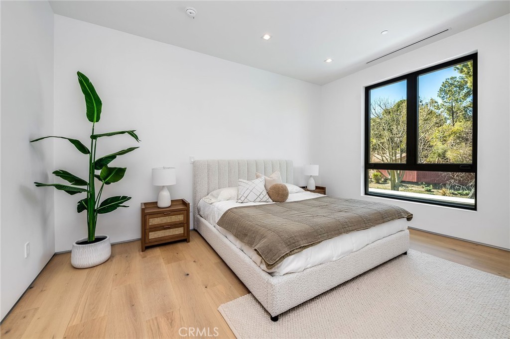 4930 Palomar Drive Tarzana, CA 91356 - Photo 35 of 43 a living room with a bed furniture and a large window