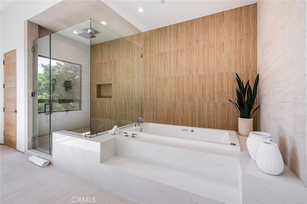 4930 Palomar Drive Tarzana, CA 91356 - Photo 41 of 43 a bathroom with a tub and shower