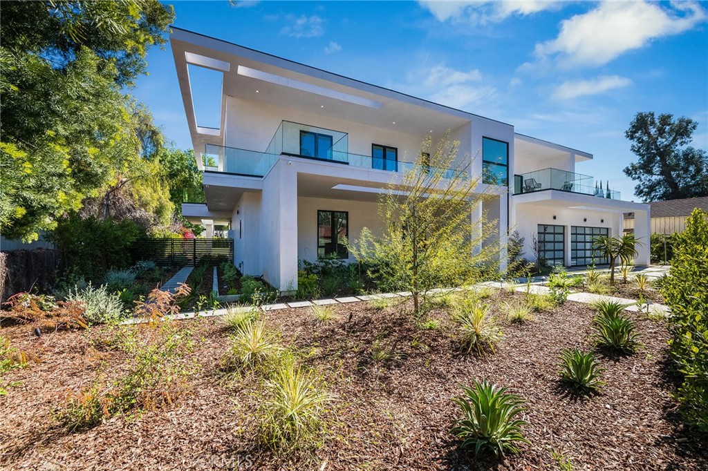 4930 Palomar Drive Tarzana, CA 91356 - Photo 5 of 43 a front view of a house with a yard