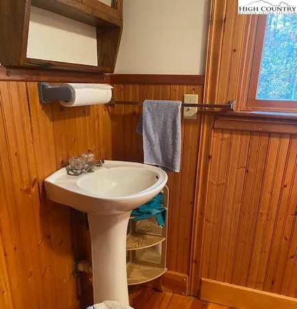 a bathroom with a sink and mirror