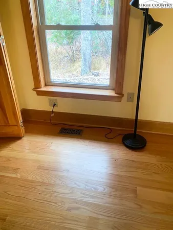 a view of a living room with a large window