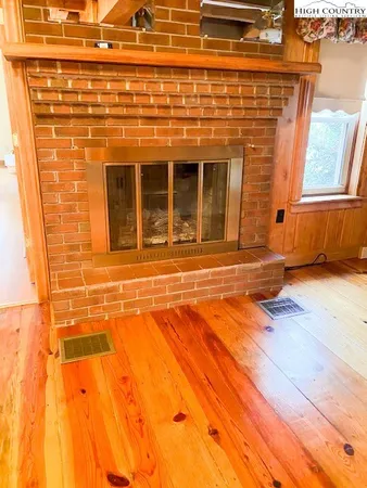 a view of a brick wall with a large window