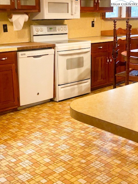 169 Woodside Road Galax, VA 24333 - Photo 8 of 49 a view of a kitchen with stainless steel appliances granite countertop a stove and a sink
