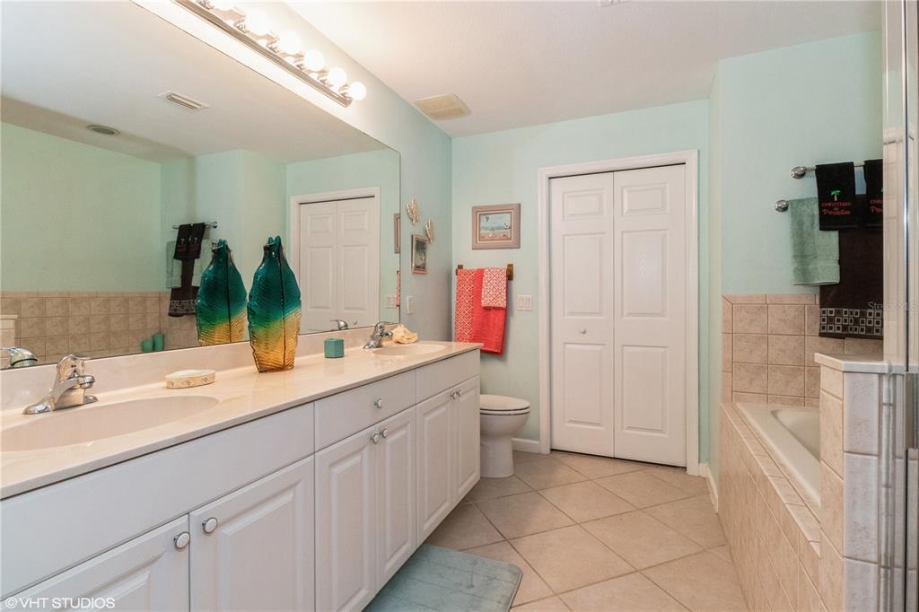 3010 Meandering Way, Unit 101 Fort Myers, FL 33905 - Photo 24 of 37 a bathroom with a sink and a mirror