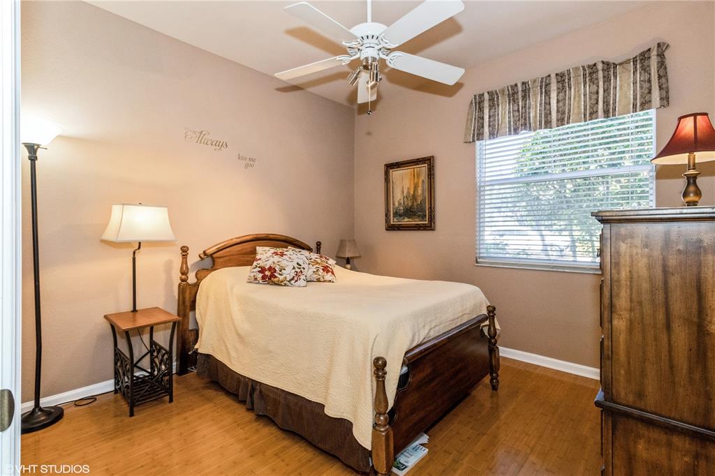 3010 Meandering Way, Unit 101 Fort Myers, FL 33905 - Photo 25 of 37 a bed sitting in a bedroom next to a window