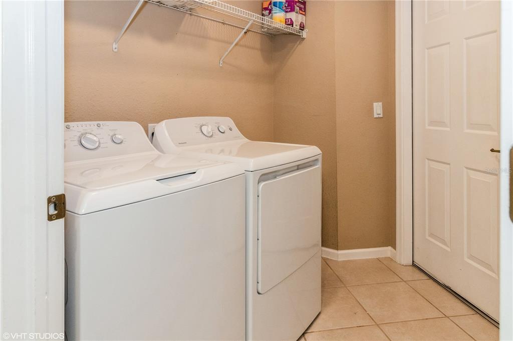 3010 Meandering Way, Unit 101 Fort Myers, FL 33905 - Photo 28 of 37 a utility room with dryer and washer