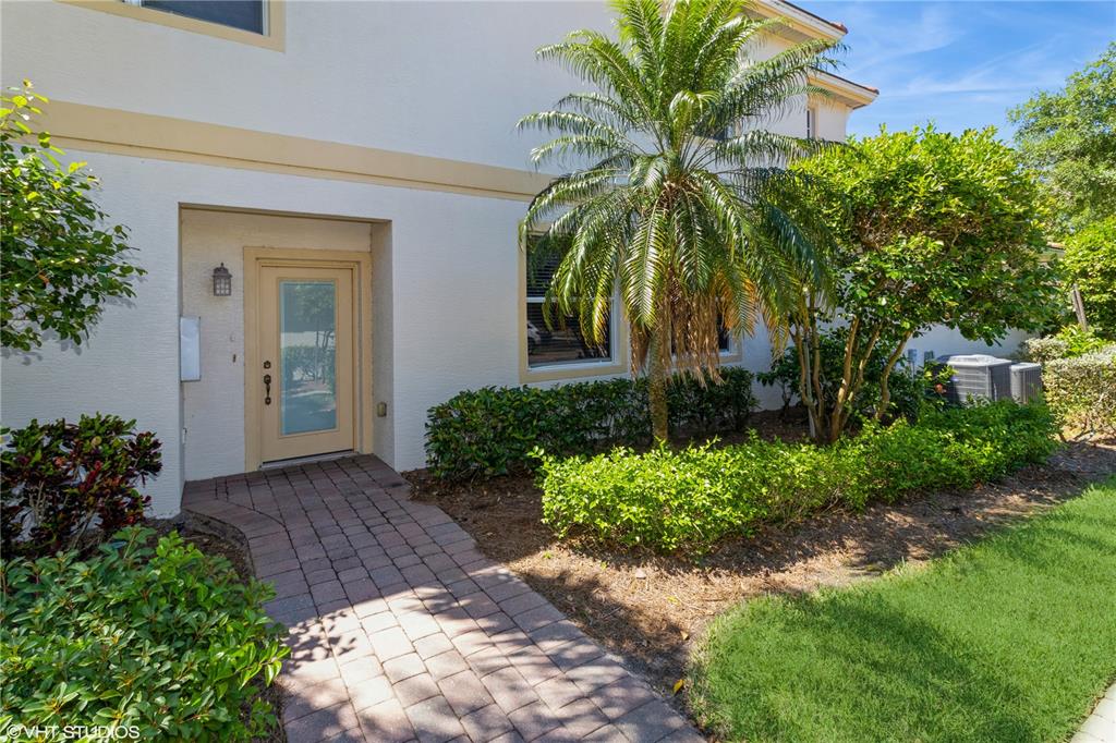 3010 Meandering Way, Unit 101 Fort Myers, FL 33905 - Photo 3 of 37 a view of a entryway with flower plants