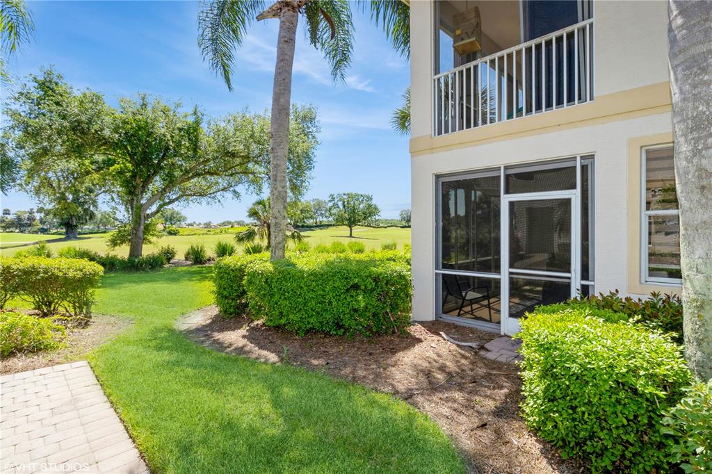 3010 Meandering Way, Unit 101 Fort Myers, FL 33905 - Photo 32 of 37 a front view of a house with a yard