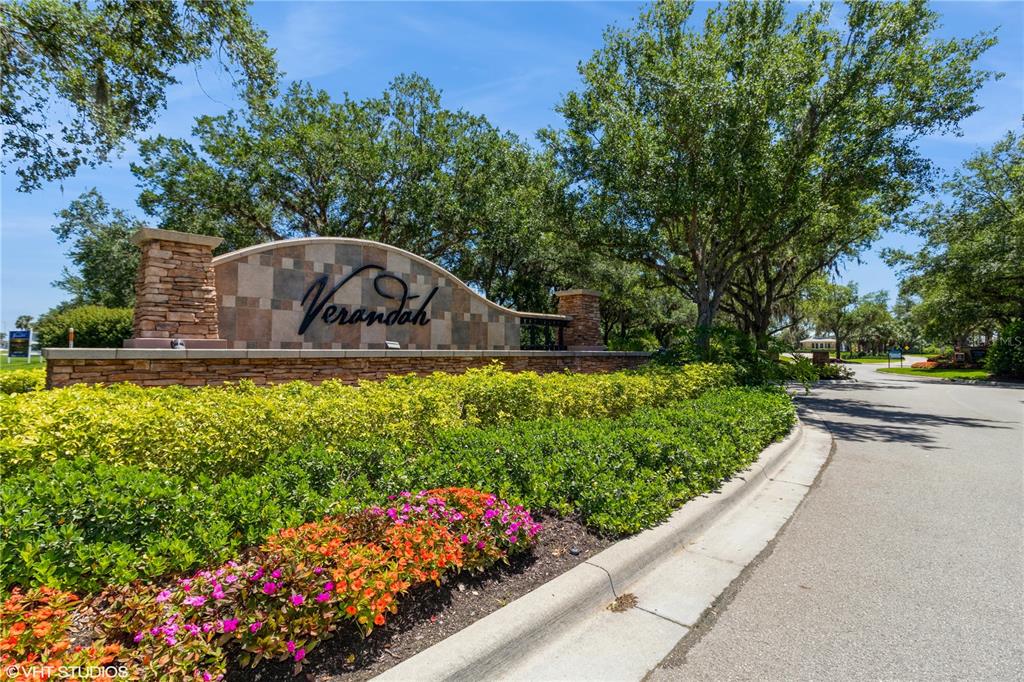 3010 Meandering Way, Unit 101 Fort Myers, FL 33905 - Photo 37 of 37 a view of a garden with a bench in the garden