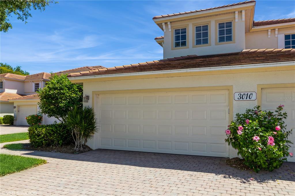 3010 Meandering Way, Unit 101 Fort Myers, FL 33905 - Photo 4 of 37 a house view with a garden space