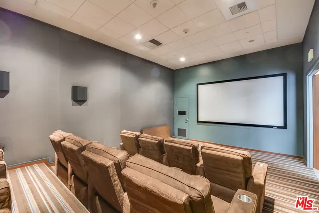 a projector room with a projector and screen