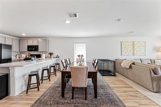 a view of a dining room with furniture