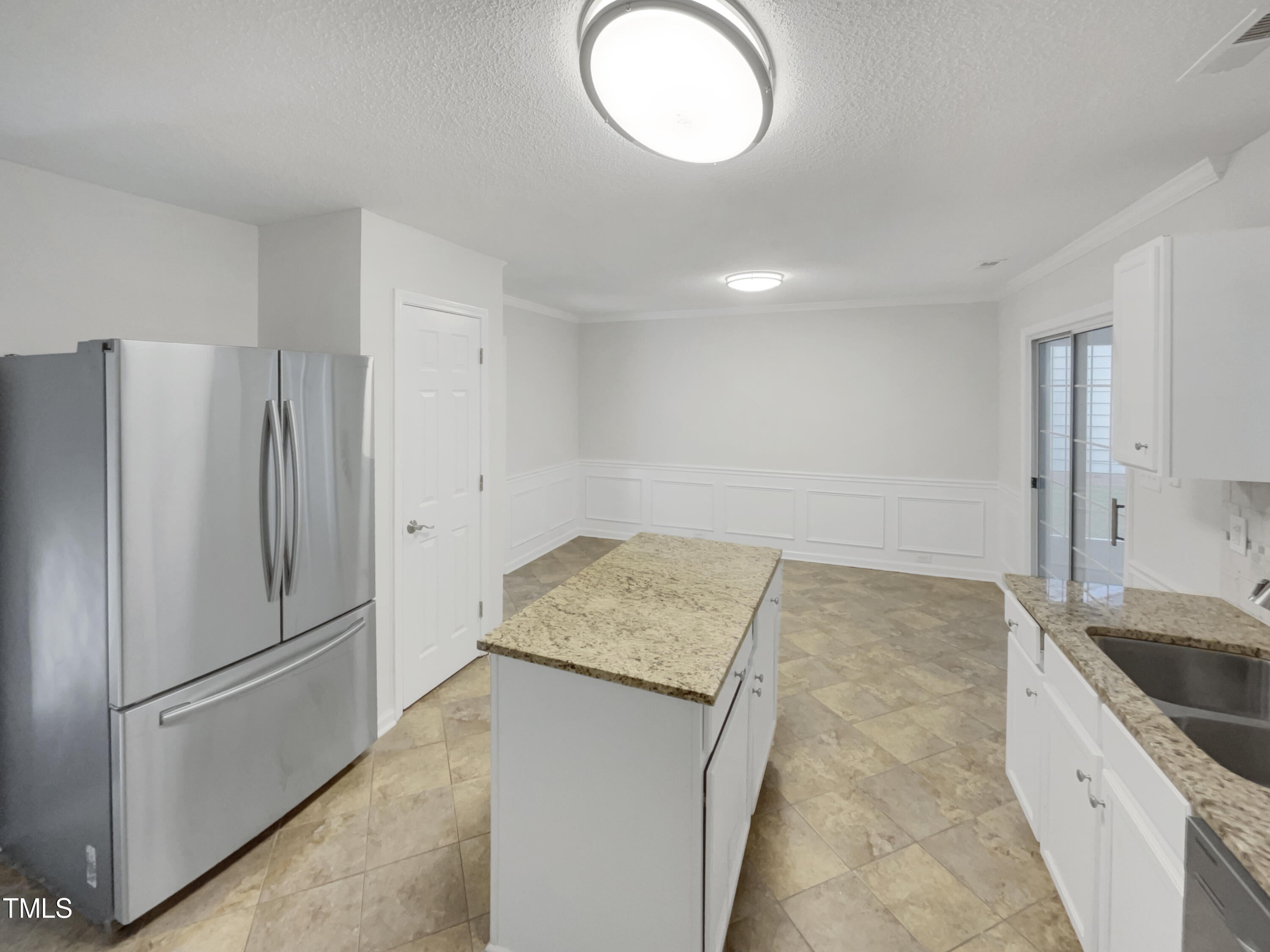 11 Windsor Glen Drive Durham, NC 27703 - Photo 14 of 29 a kitchen with a refrigerator and a sink