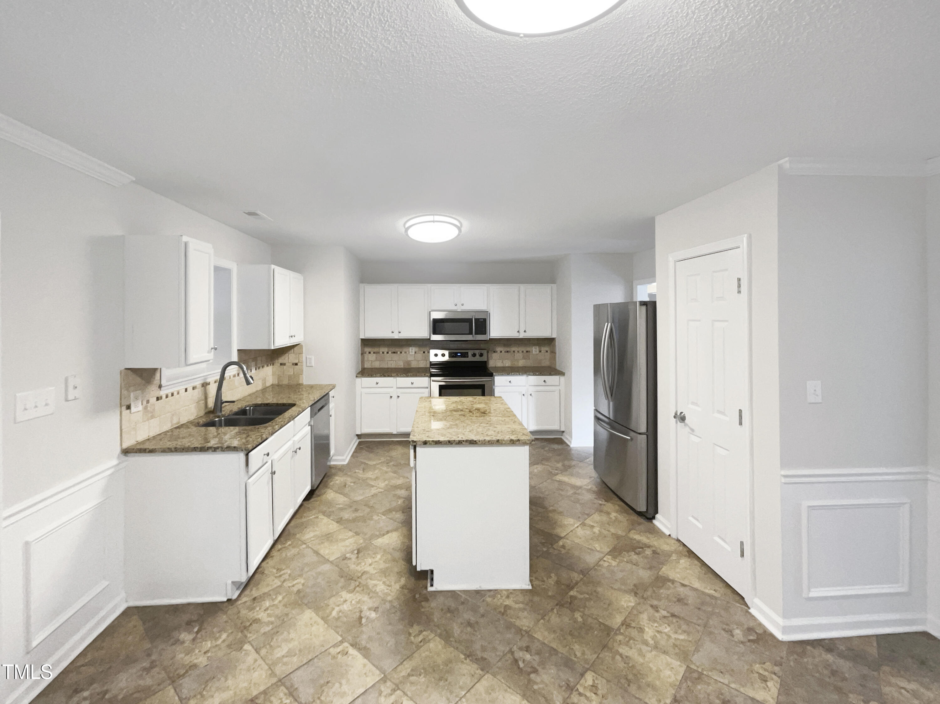 11 Windsor Glen Drive Durham, NC 27703 - Photo 15 of 29 a kitchen with a stove a refrigerator and a sink