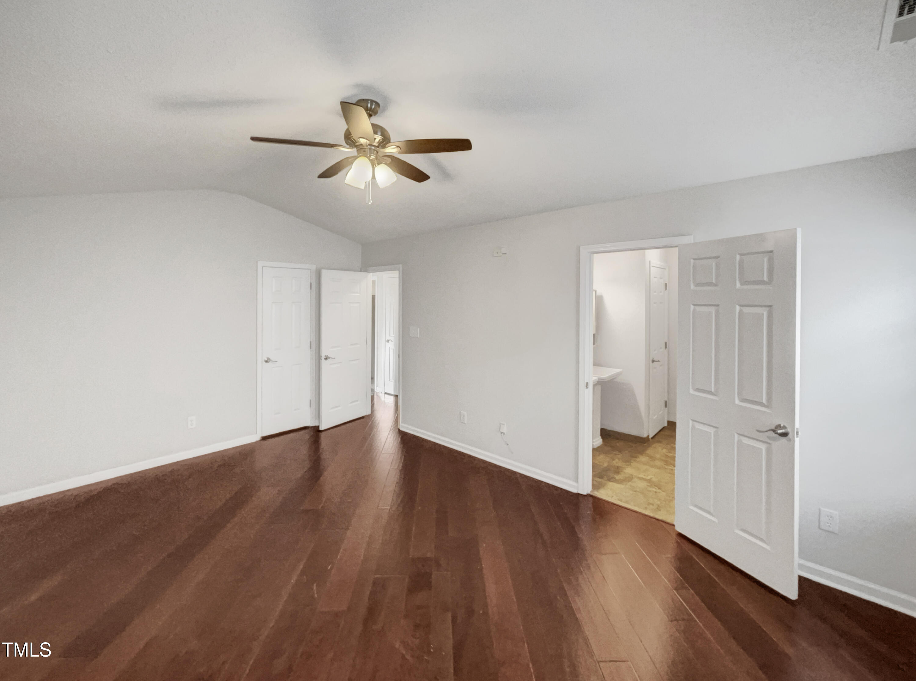 11 Windsor Glen Drive Durham, NC 27703 - Photo 18 of 29 an empty room with wooden floor fan and windows