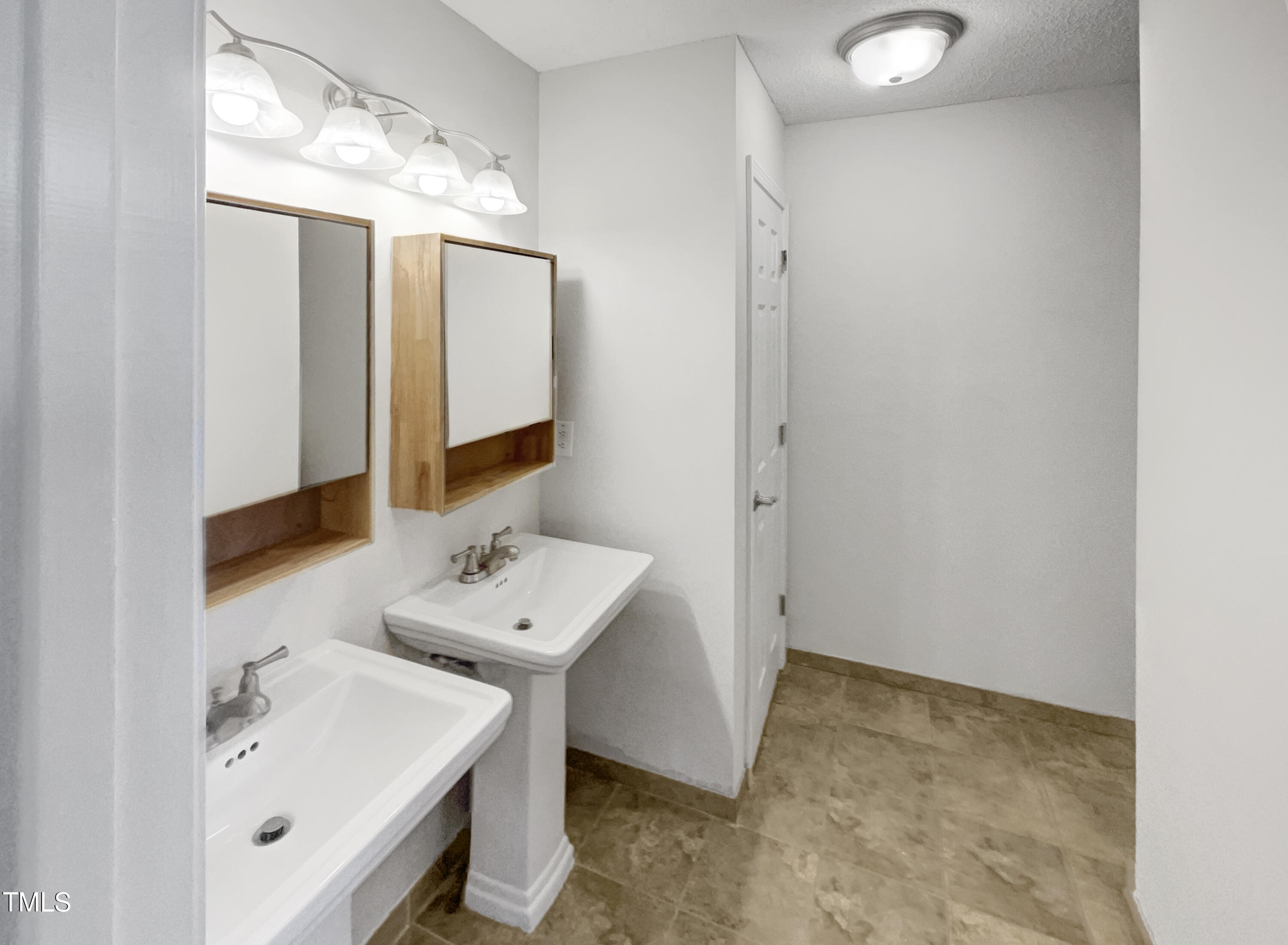 11 Windsor Glen Drive Durham, NC 27703 - Photo 19 of 29 a bathroom with a sink and a mirror