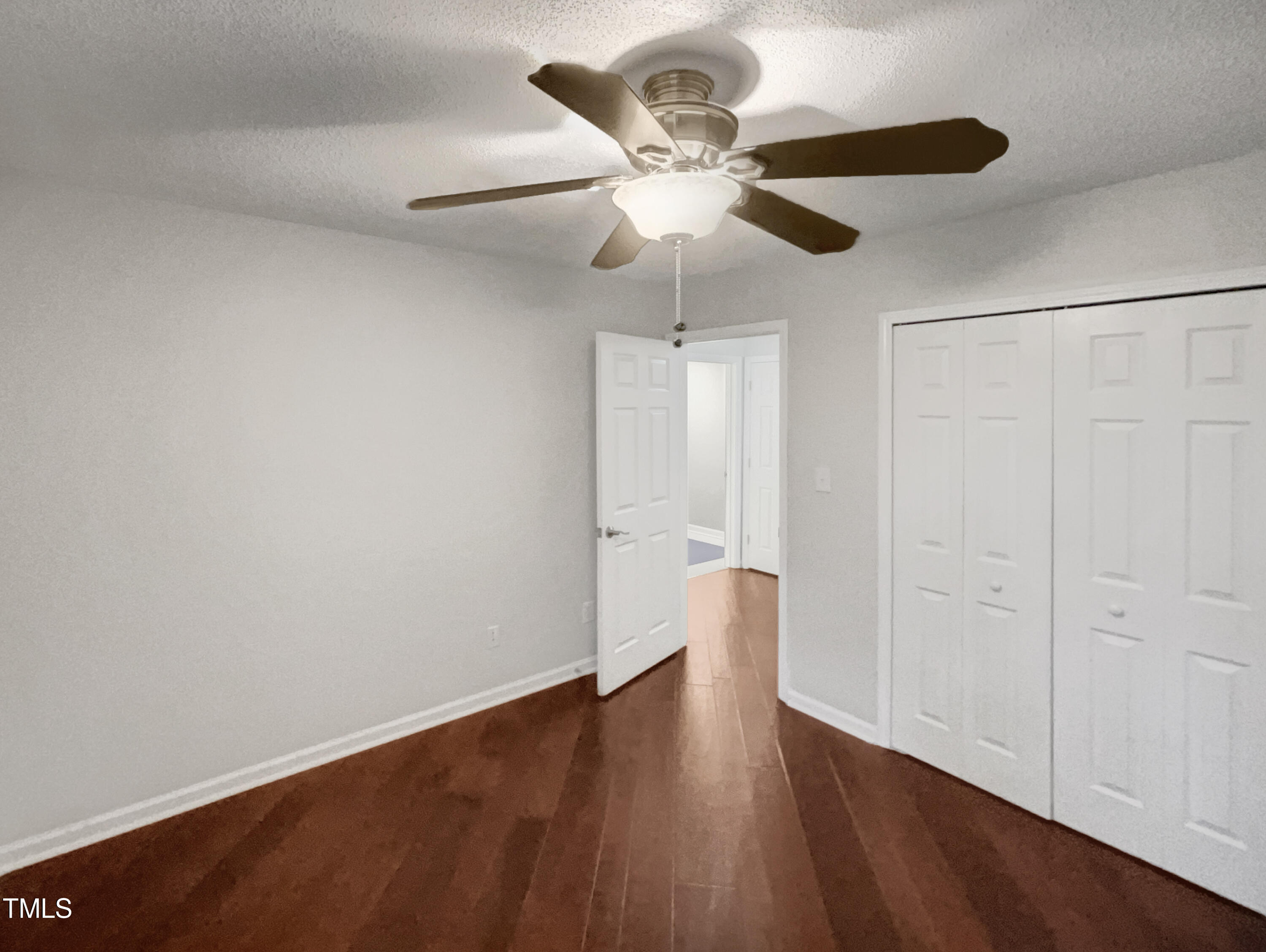 11 Windsor Glen Drive Durham, NC 27703 - Photo 29 of 29 a view of an empty room with wooden floor