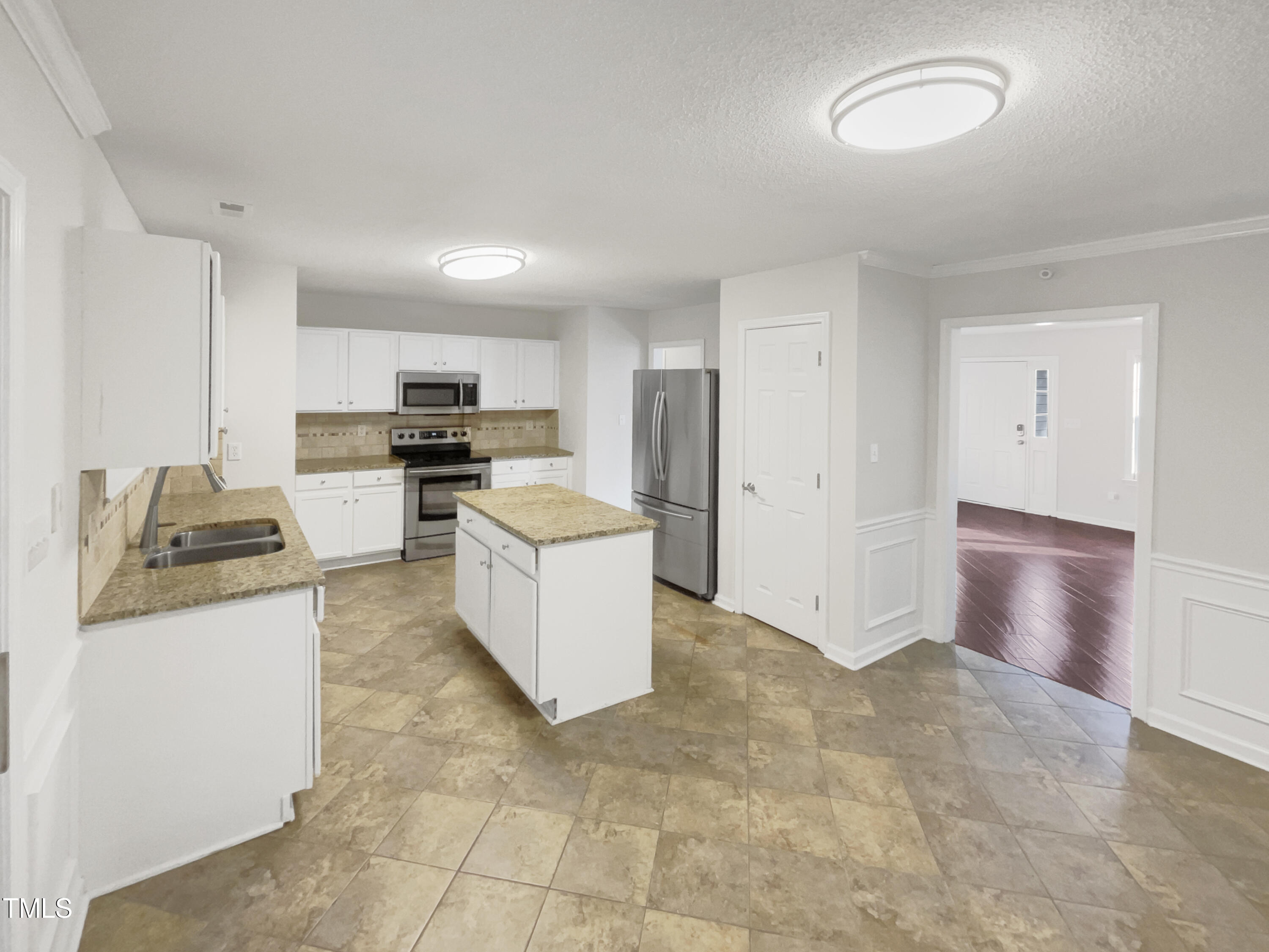11 Windsor Glen Drive Durham, NC 27703 - Photo 6 of 29 a kitchen with stainless steel appliances granite countertop a stove top oven a sink a refrigerator and white cabinets