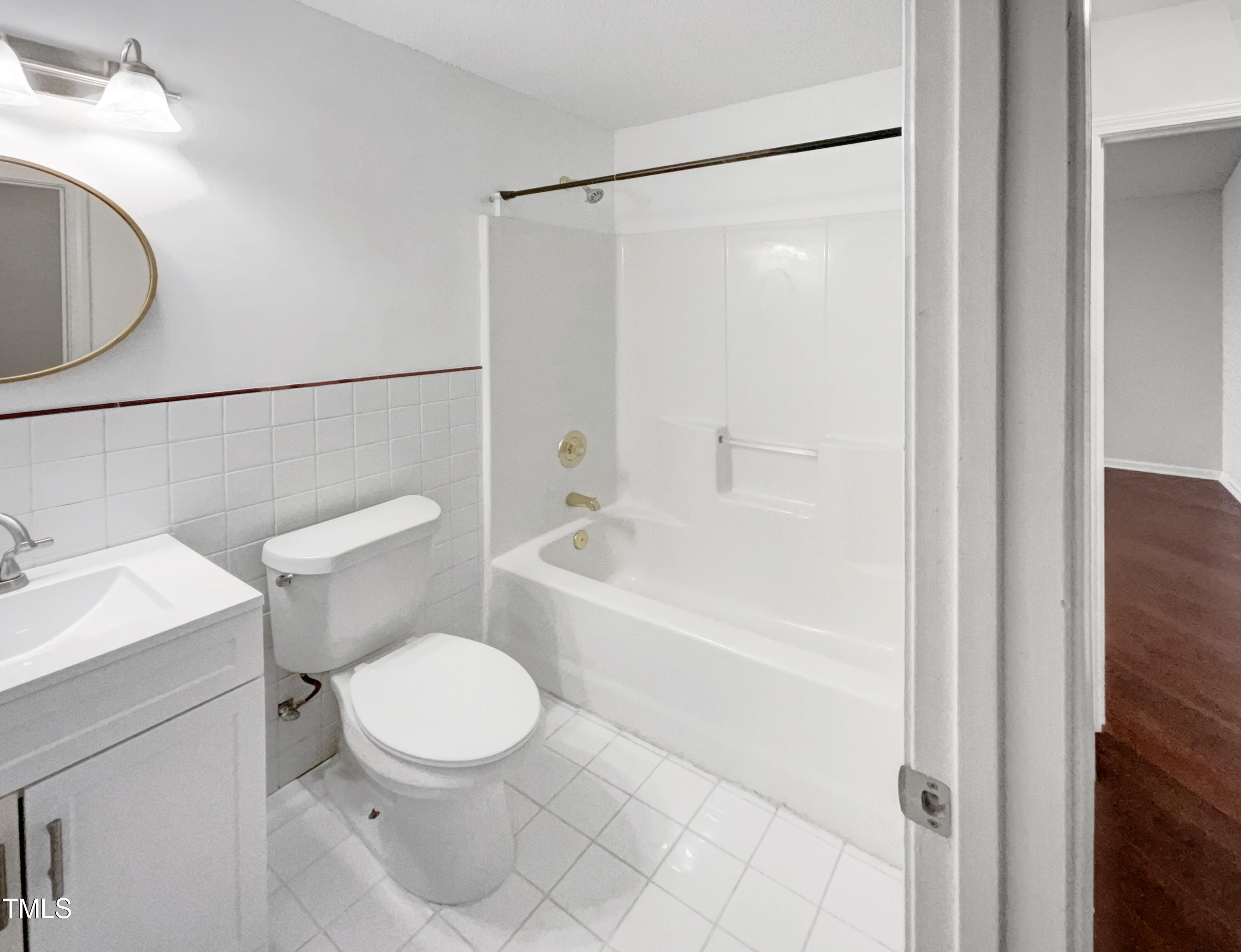 11 Windsor Glen Drive Durham, NC 27703 - Photo 7 of 29 a bathroom with a toilet and a bathtub