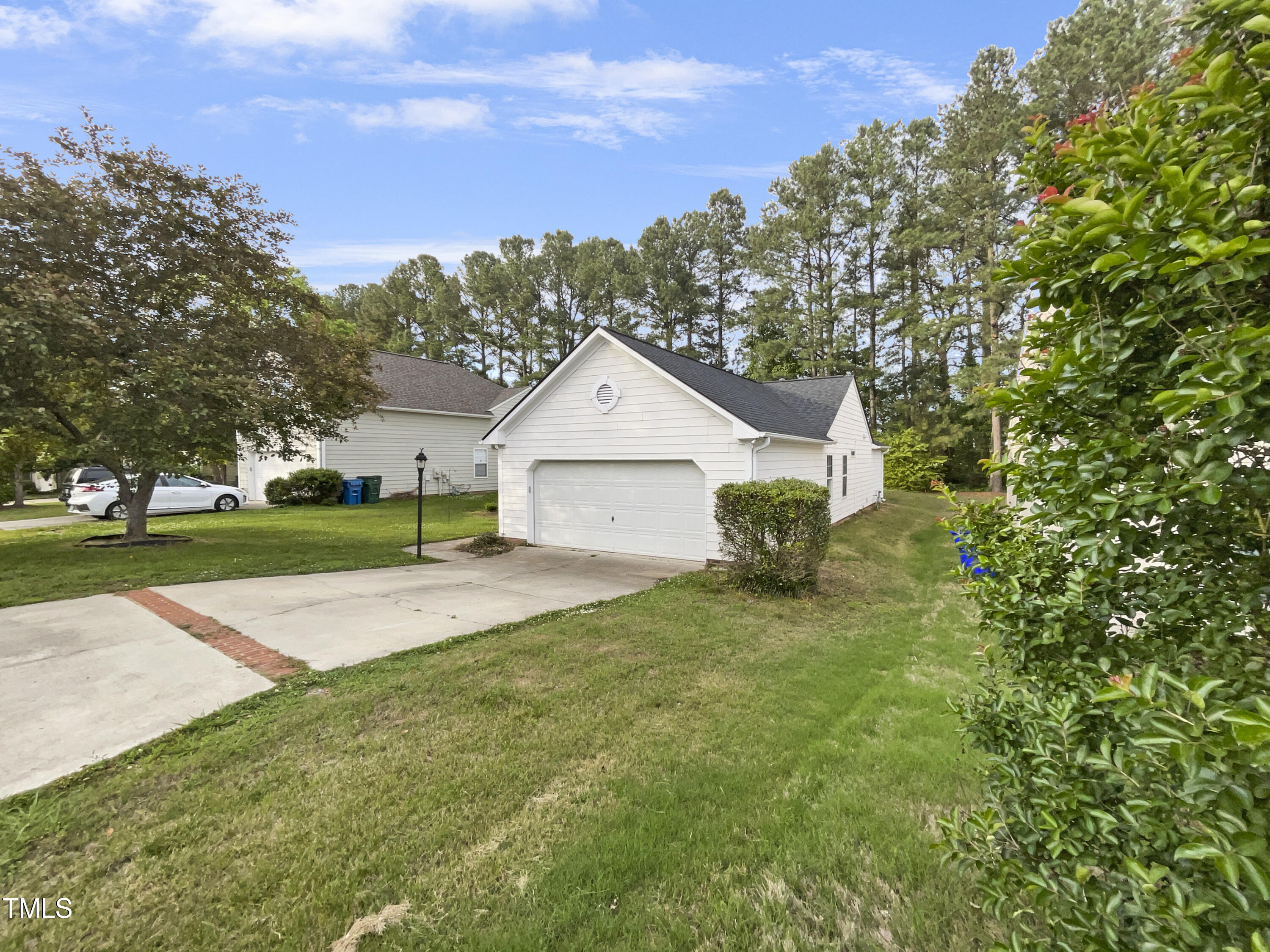 11 Windsor Glen Drive Durham, NC 27703 - Photo 10 of 29 a house view with a garden space