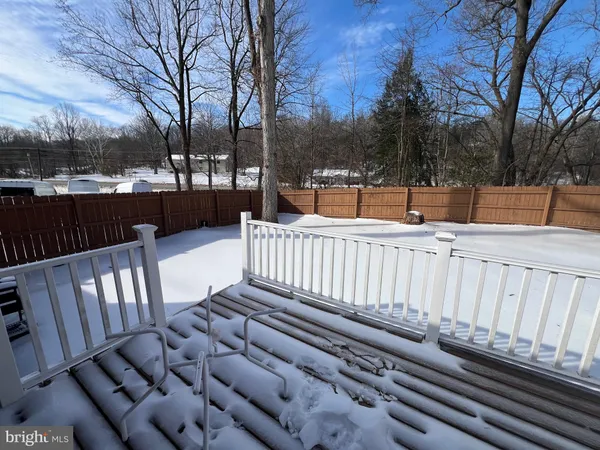 a view of a wooden deck with a bench