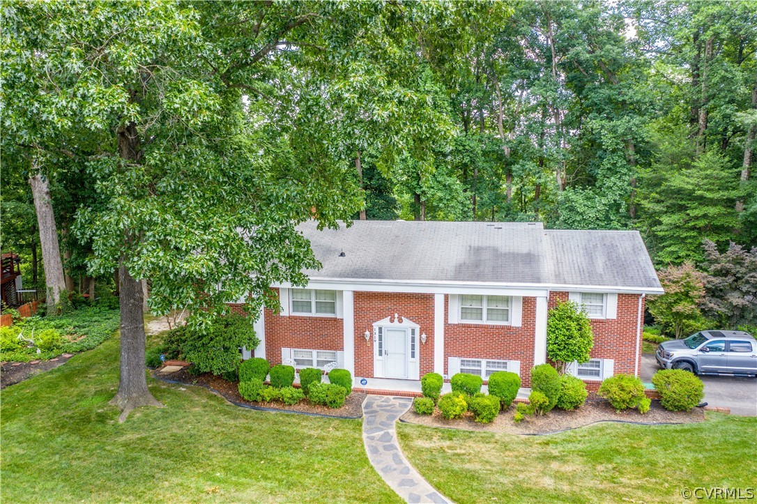 1319 Covington Road Colonial Heights, VA 23834 - Photo 36 of 44 a front view of a house with garden