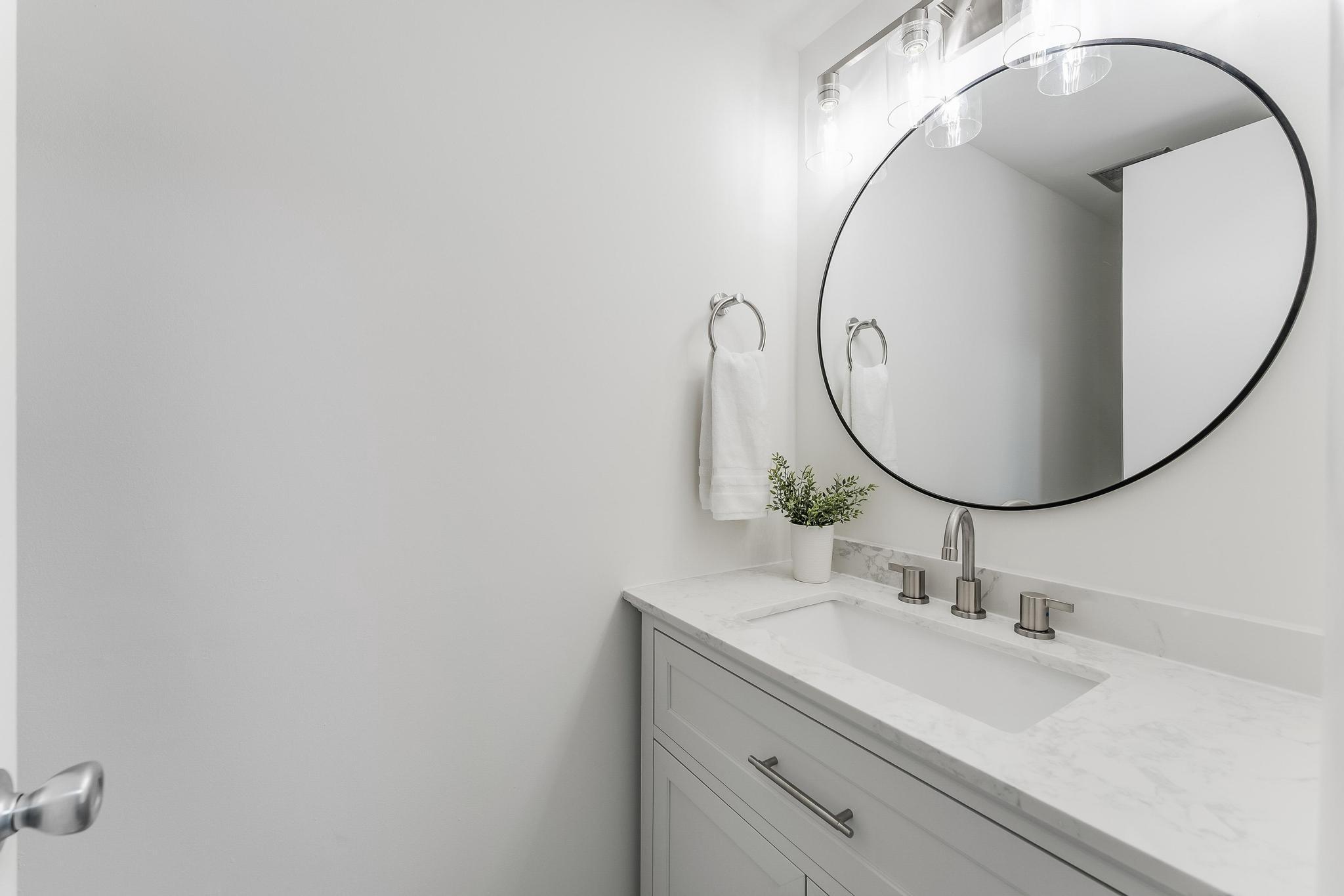 12023 Insha Court Reston, VA 20191 - Photo 5 of 52 a bathroom with a sink and a mirror