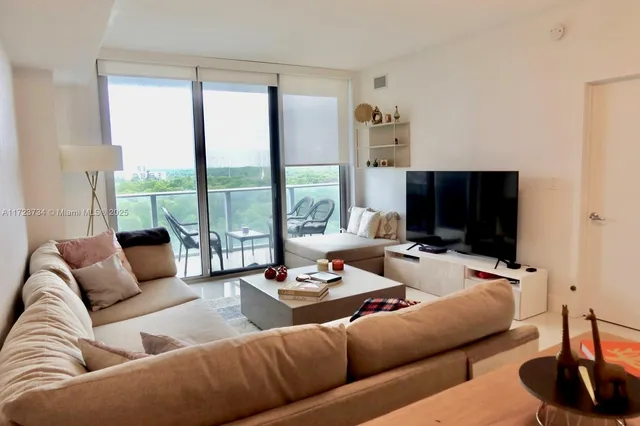 a kitchen with stainless steel appliances kitchen island granite countertop a sink and cabinets