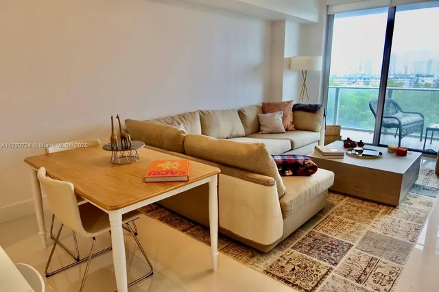 a bedroom with two beds and a dresser