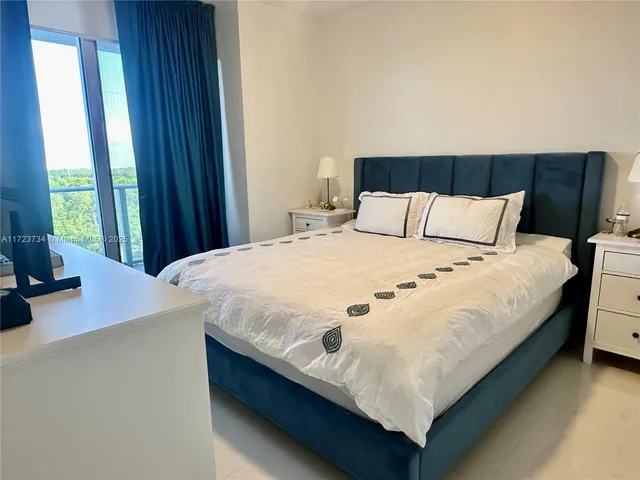 a view of a house with a tree