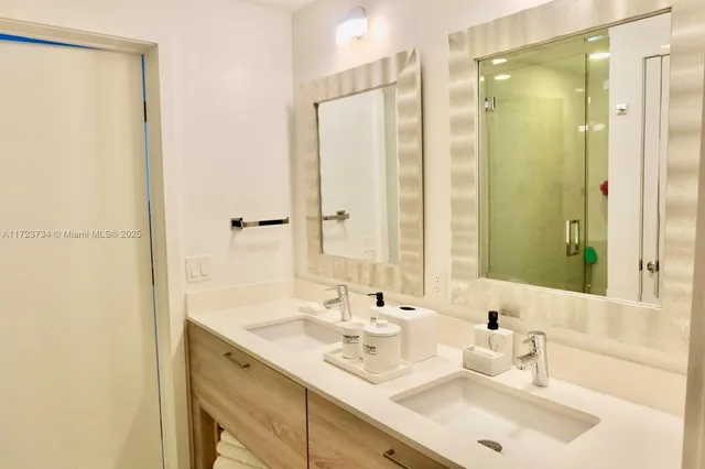 a view of a patio with table and chairs and potted plants