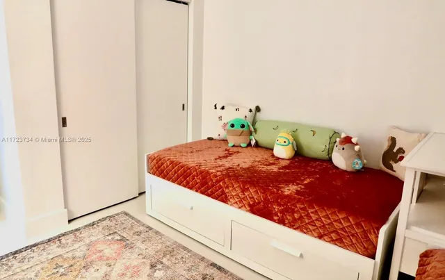 a room with lots of furniture and a large window