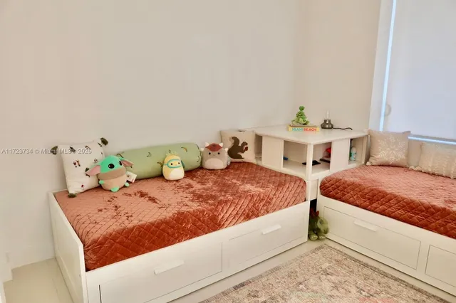 a view of a room with furniture and window