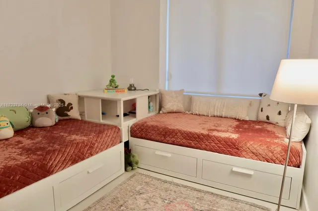 a room with wooden floor table and chairs