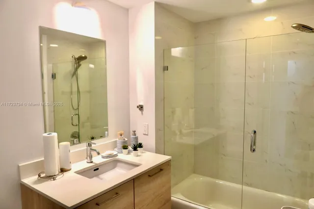 a room with furniture pool table and flat screen tv