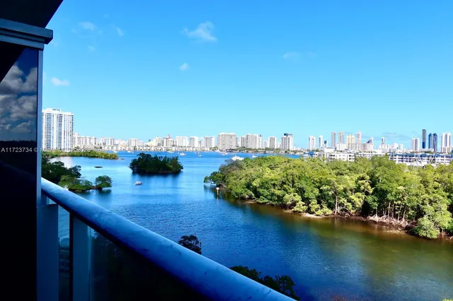 a balcony with table and chairs