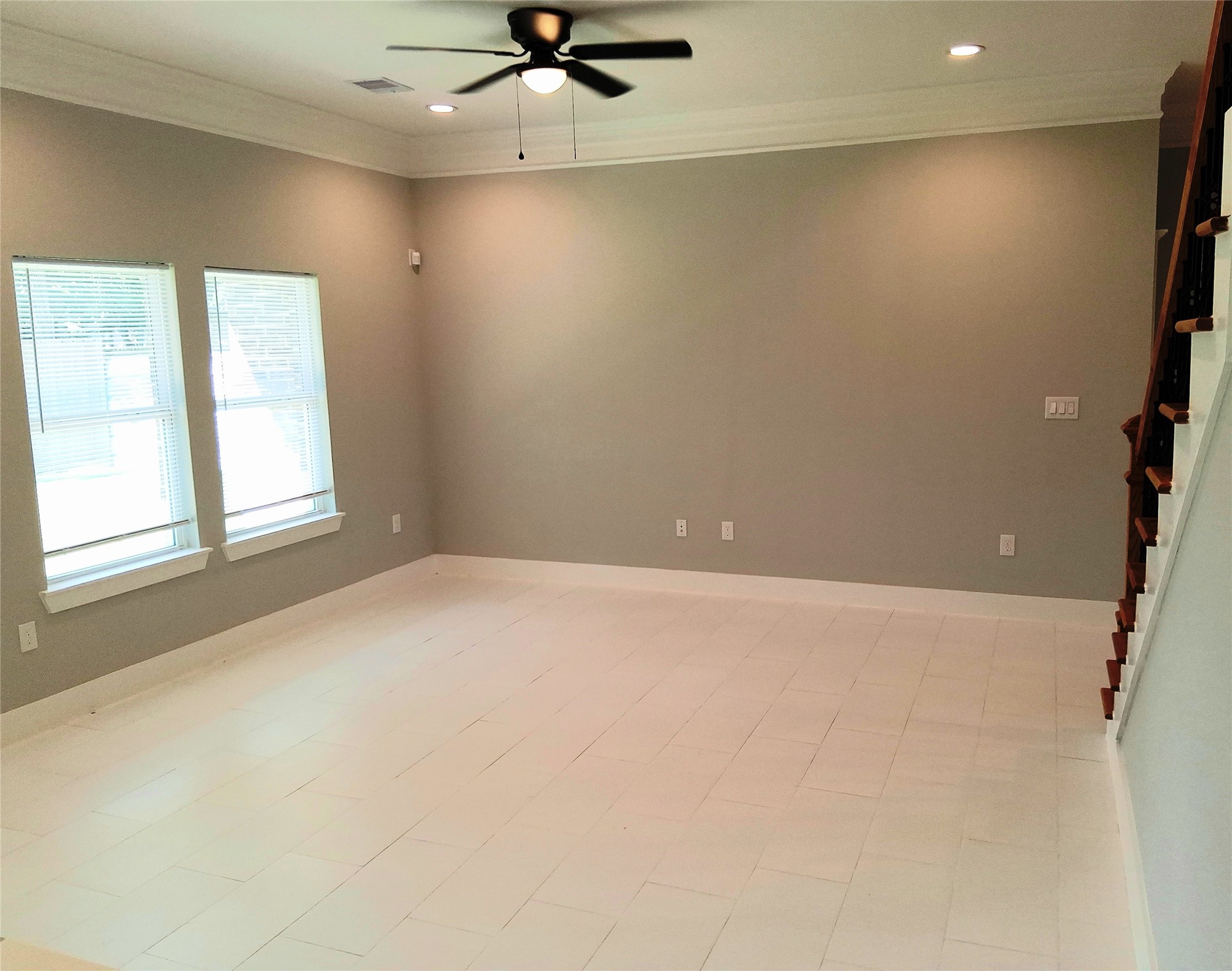9001 Cheer Street Houston, TX 77063 - Photo 11 of 29 an empty room with a window and a ceiling fan