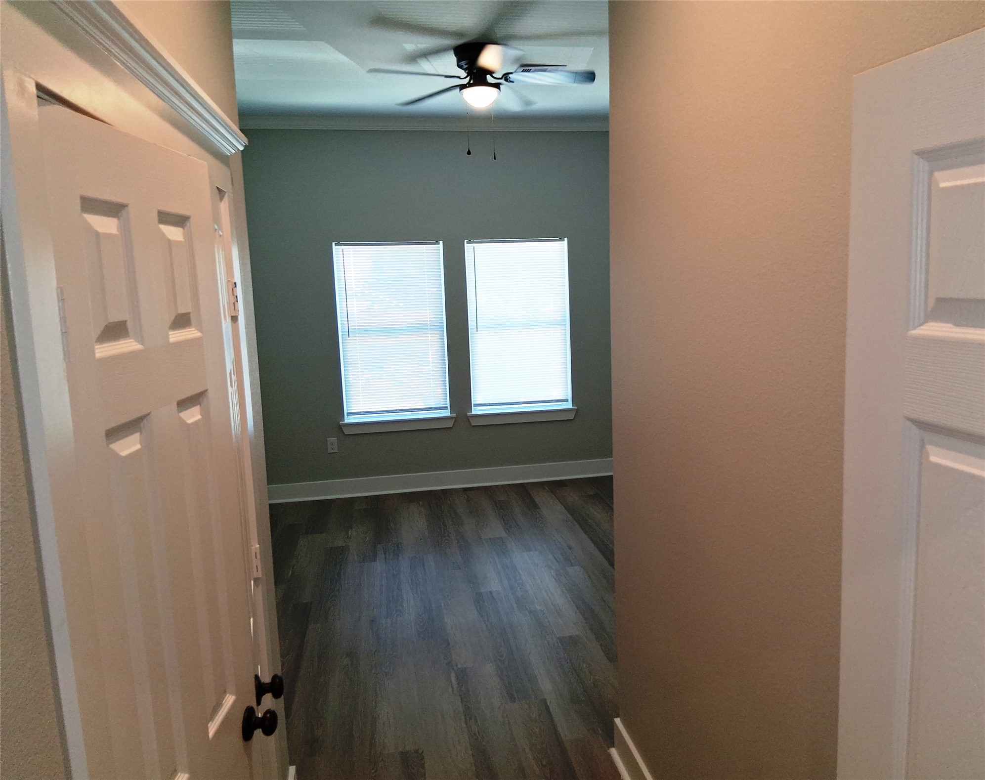 9001 Cheer Street Houston, TX 77063 - Photo 23 of 29 a view of an empty room with wooden floor and a window