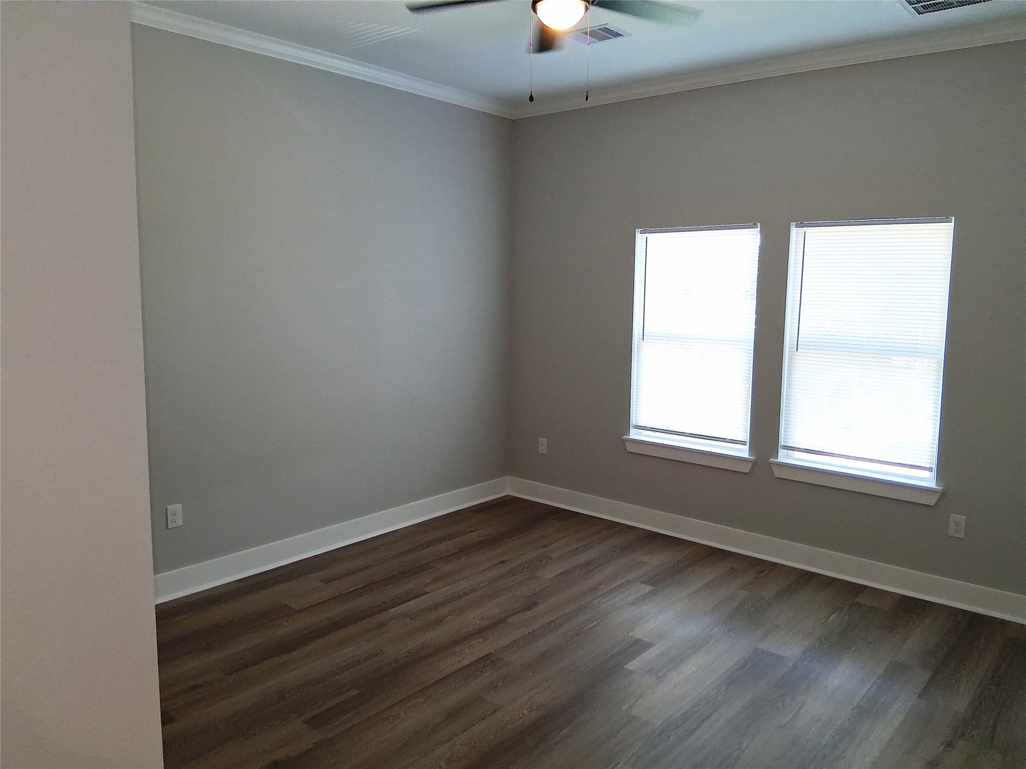 9001 Cheer Street Houston, TX 77063 - Photo 24 of 29 an empty room with wooden floor and windows